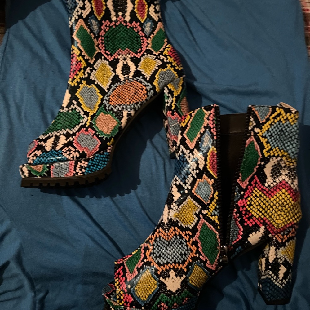 Multi print boot. Zip up on the side never worn. Peep toe